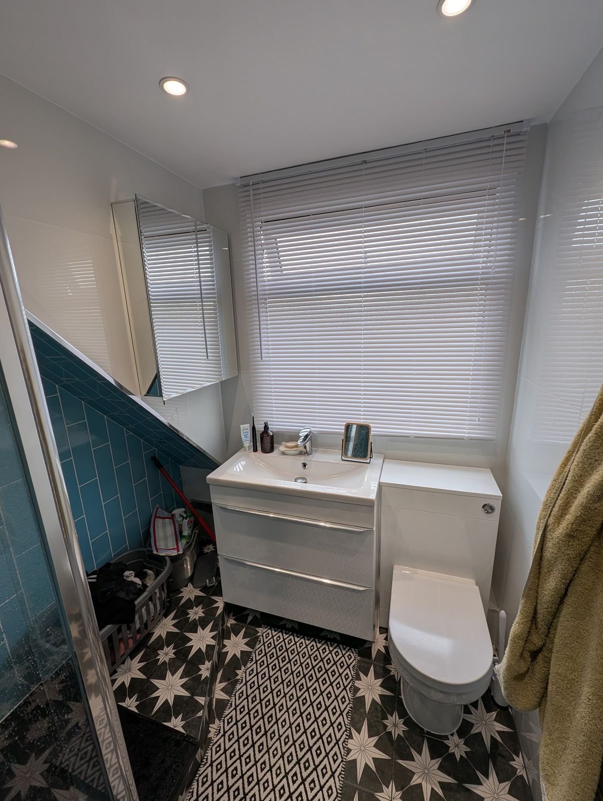 Vanity unit on star-pattern floor tiles