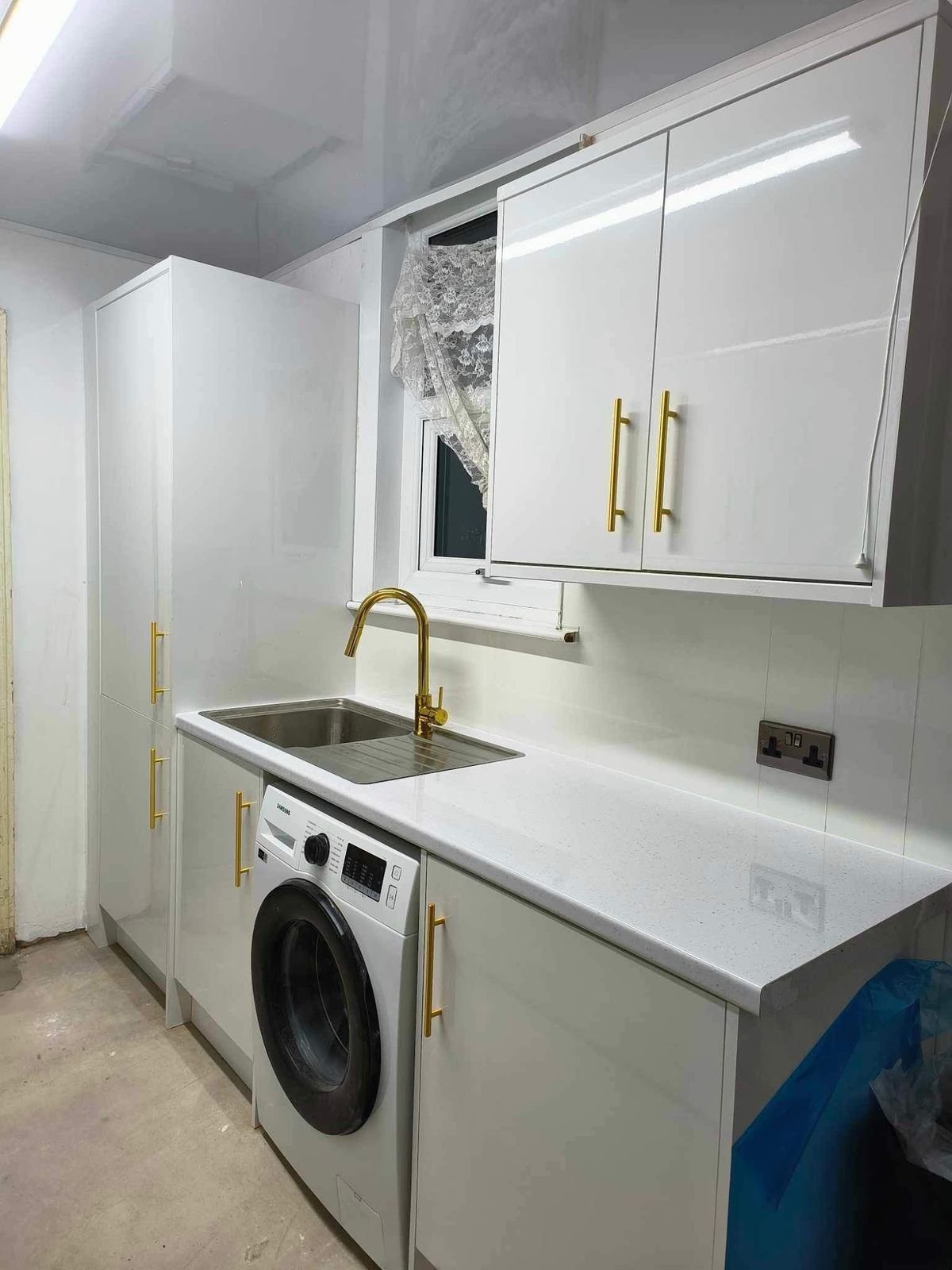 Utility with gold tap and washer housing