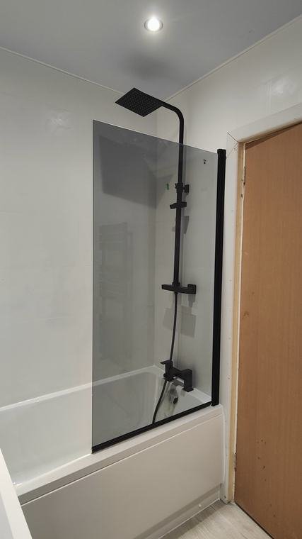 Black shower set over the bath