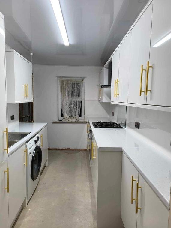 Galley kitchen with gold bar handles