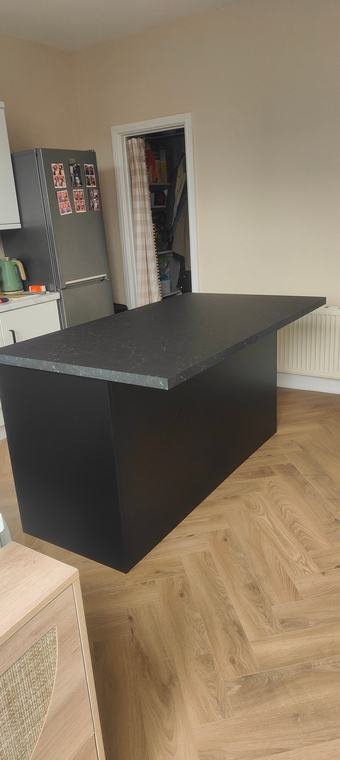 Black island on a herringbone floor